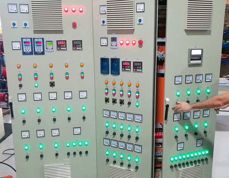 Industrial control panel with three cabinets featuring illuminated buttons, switches, digital displays, and LED indicators